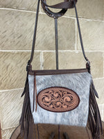 Load image into Gallery viewer, Cowhide crossbody fringe bag with unique oval carving
