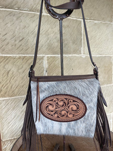 Cowhide crossbody fringe bag with unique oval carving