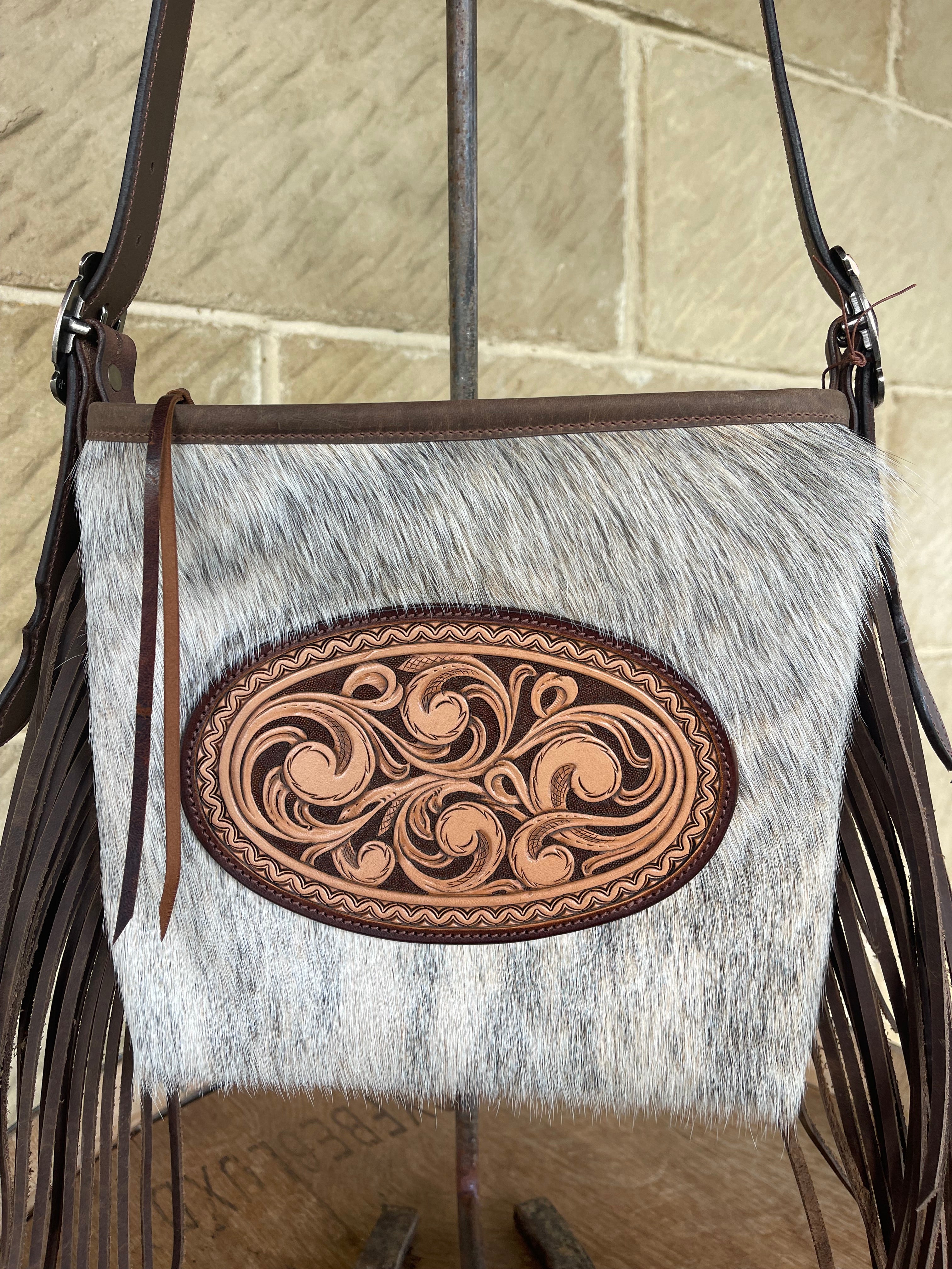 Cowhide crossbody fringe bag with unique oval carving