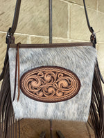 Load image into Gallery viewer, Cowhide crossbody fringe bag with unique oval carving
