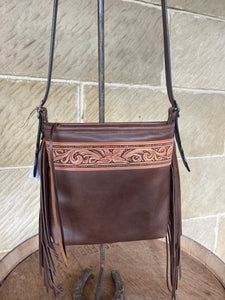 Walnut crossbody fringe bag with unique floral carving