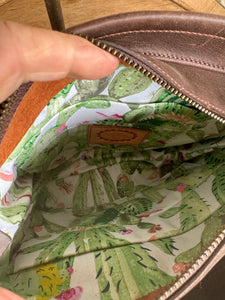 RUSTIC BLOOM CROSSBODY FRINGE BAG with unique floral carving